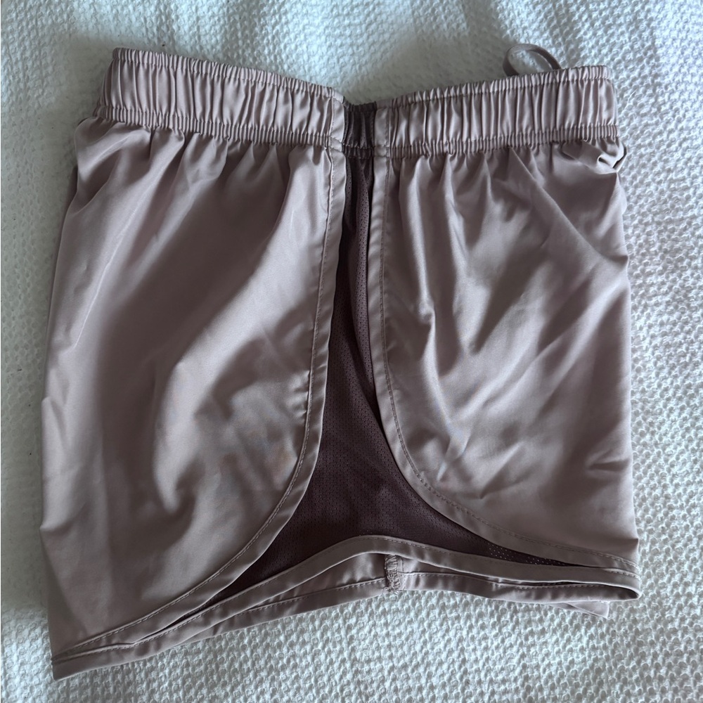 Nike Dri-FIT shorts with built in liner. Women's small in a pink/purple color.